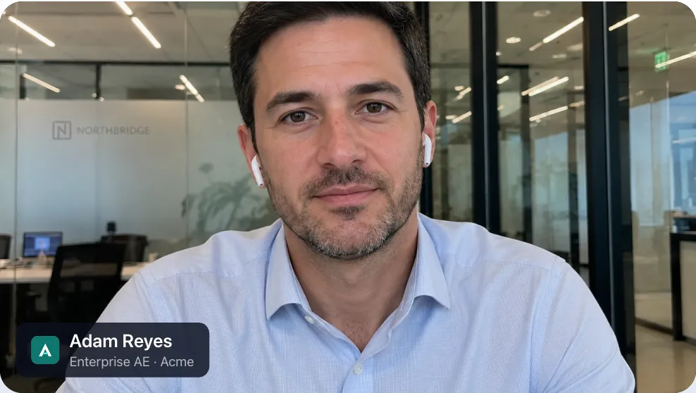 A video call frame showing Adam Reyes with a nametag reading Enterprise AE, Acme